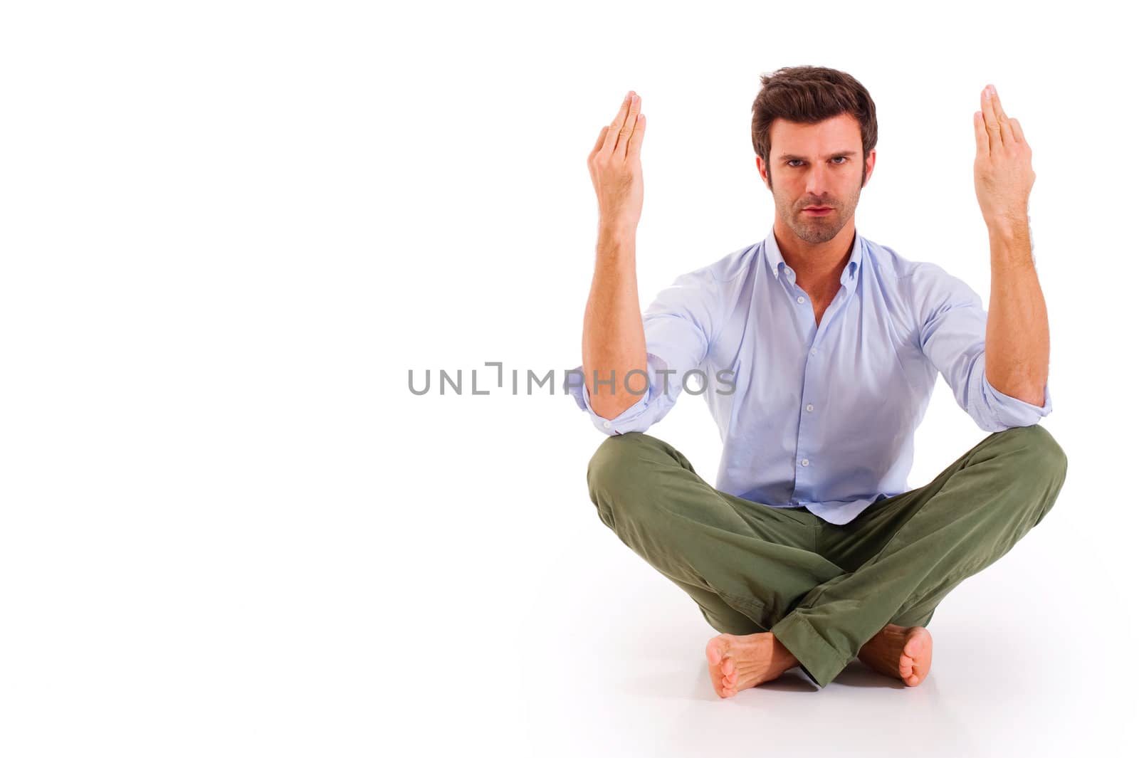 man practicing yoga by ambro
