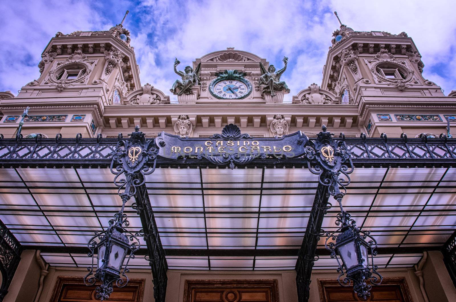 Monte Carlo casino entrance, blue sky and white clouds background, Monaco