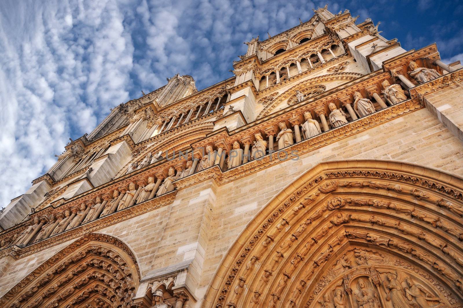 Notre Dame cathedral in Paris, blue sky and whiet clouds