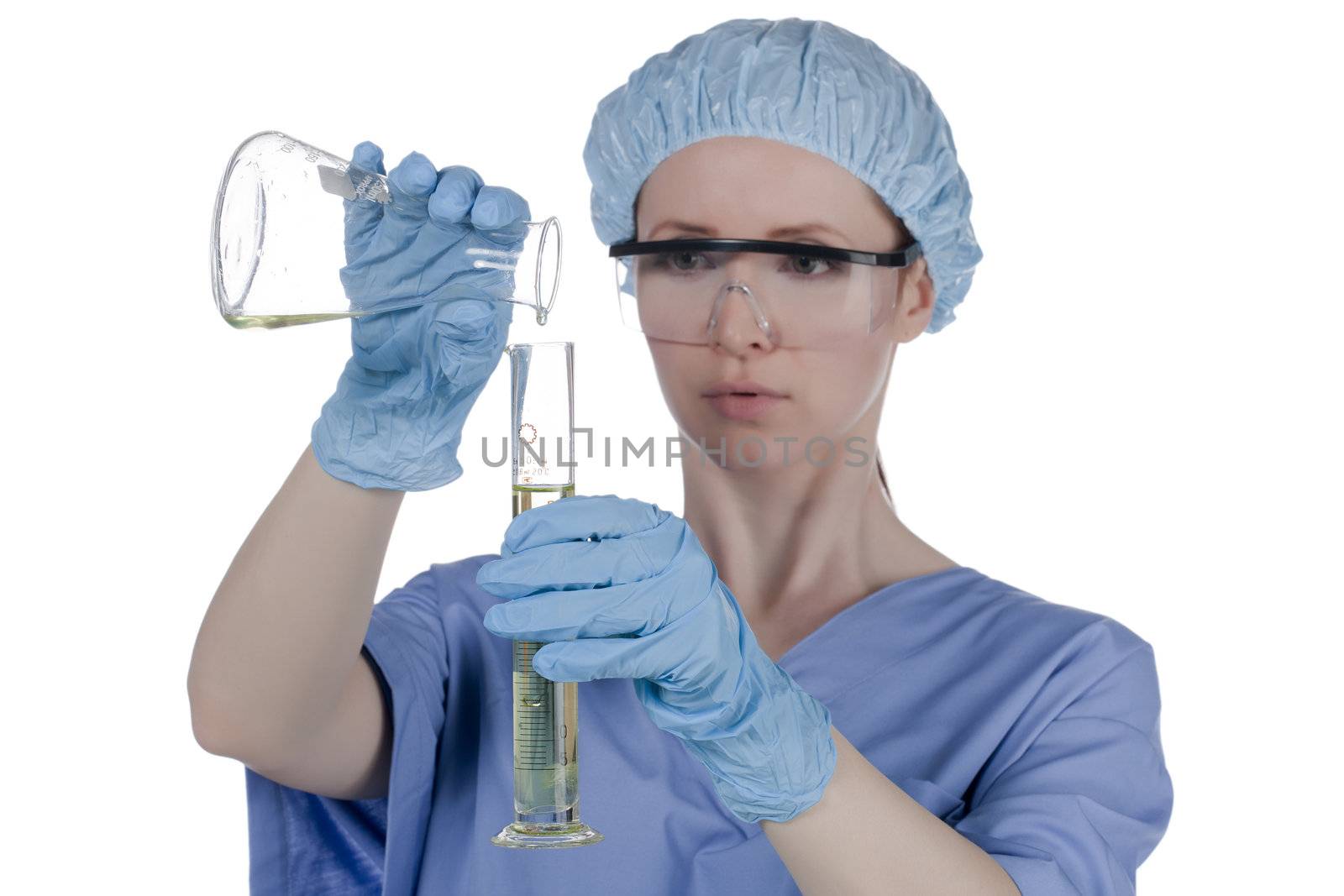 Female chemist mixing chemicals in test tube