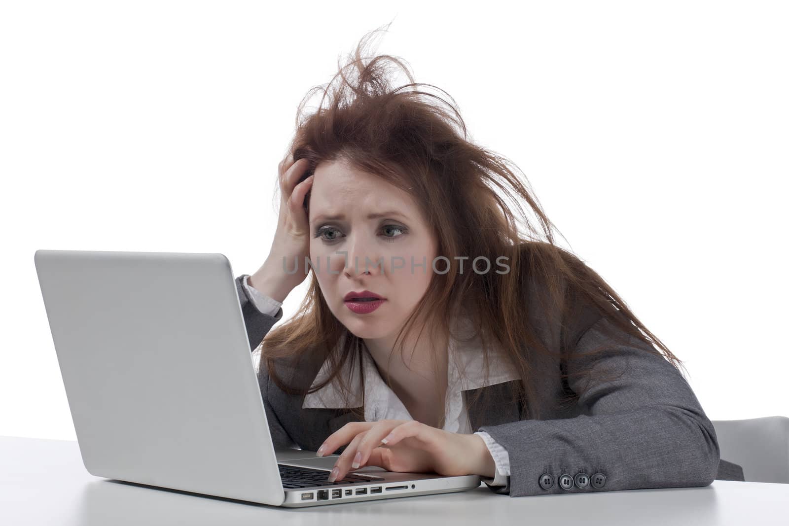 Portrait of a stressed businesswoman working with his laptop