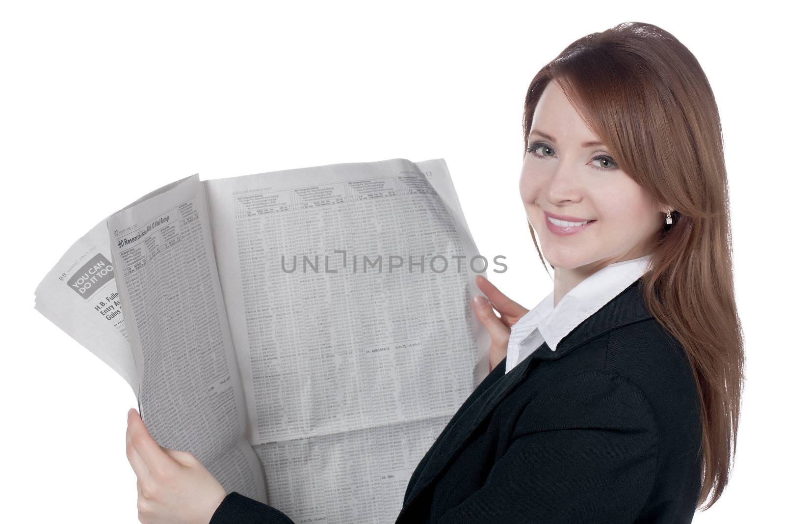 Close-up image of a happy businesswoman reading newspaper against the white surface