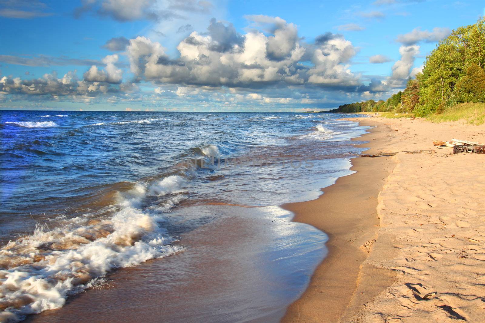 Waves along the beach of Lake Superior in northern Michigan under beautiful sunlight.