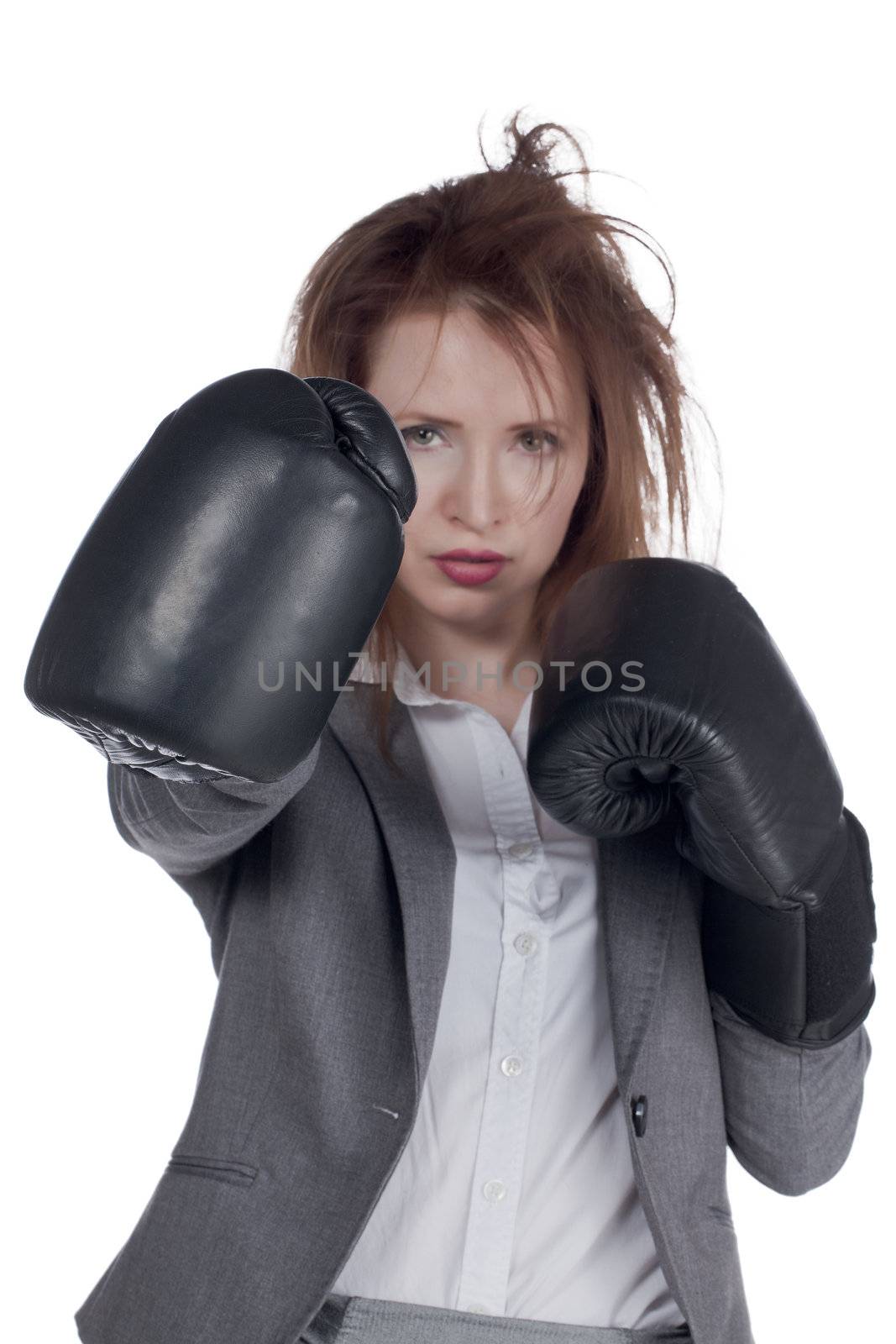 Close-up image of a stressed businesswoman with boxing gloves isolated on a white surface