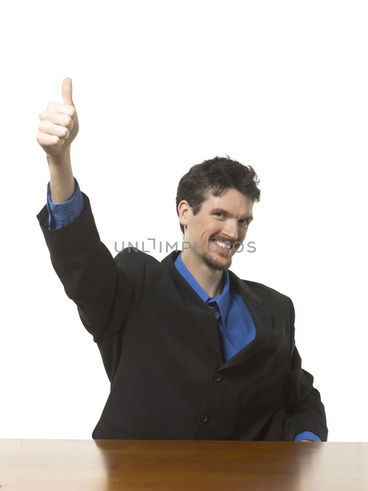 Portrait of happy businessman gesturing thumbs up against white background 