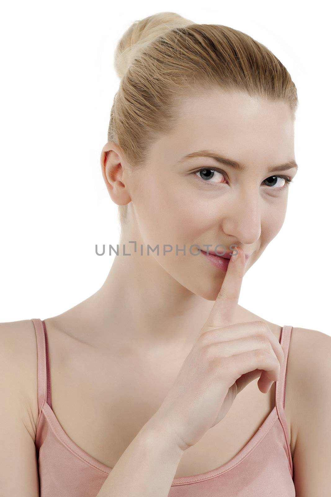 Close-up image of beautiful lady in a silence gesture isolated on a white background 