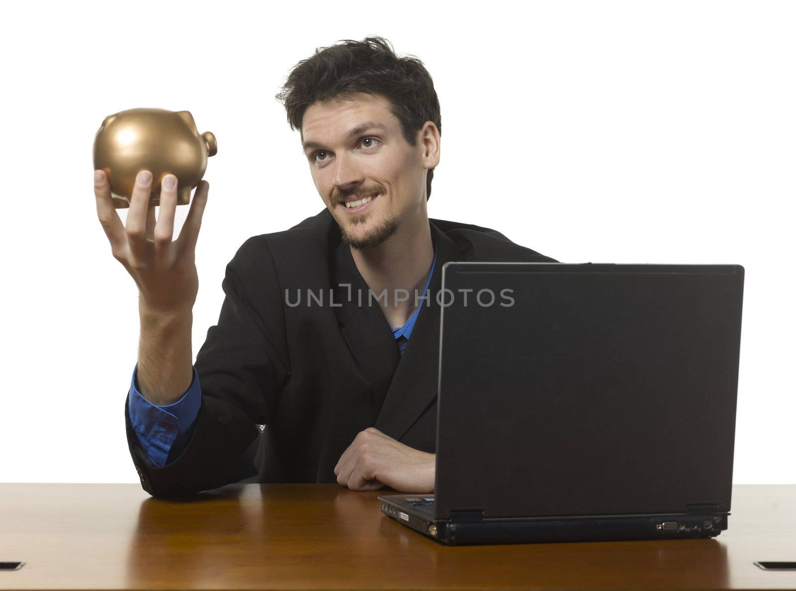 Close-up image of a happy businessman holding golden piggy bank against the white background