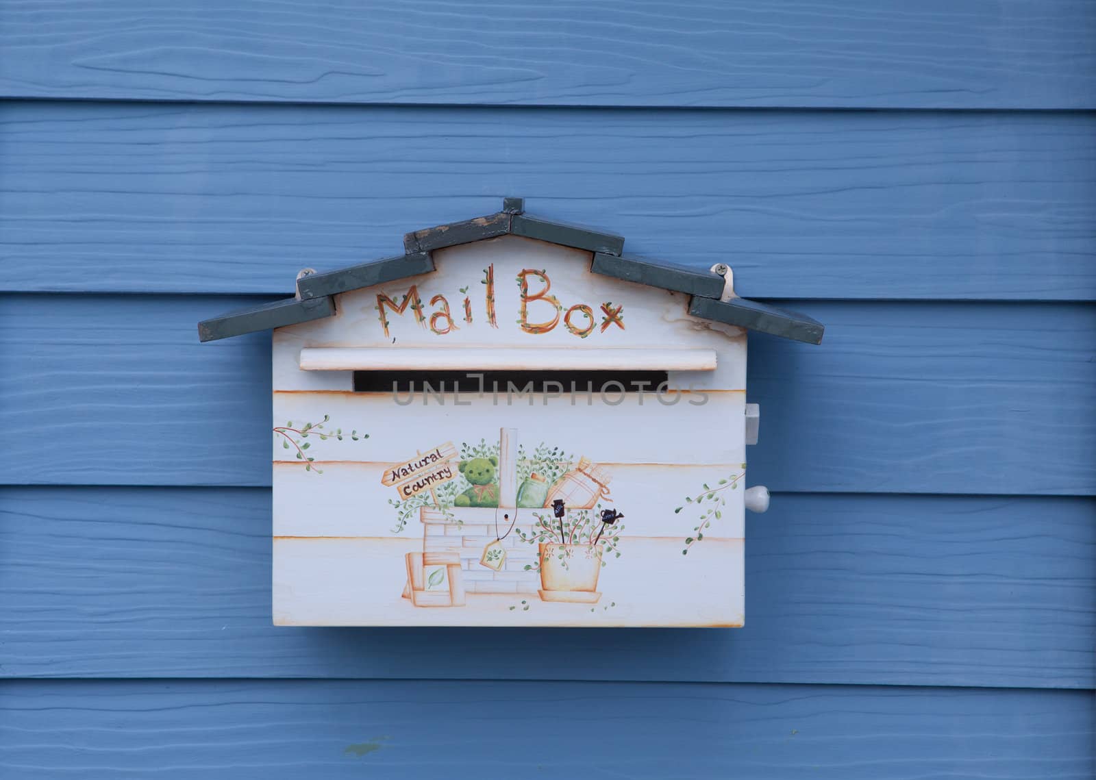 Wood mail box on wood blue wall background