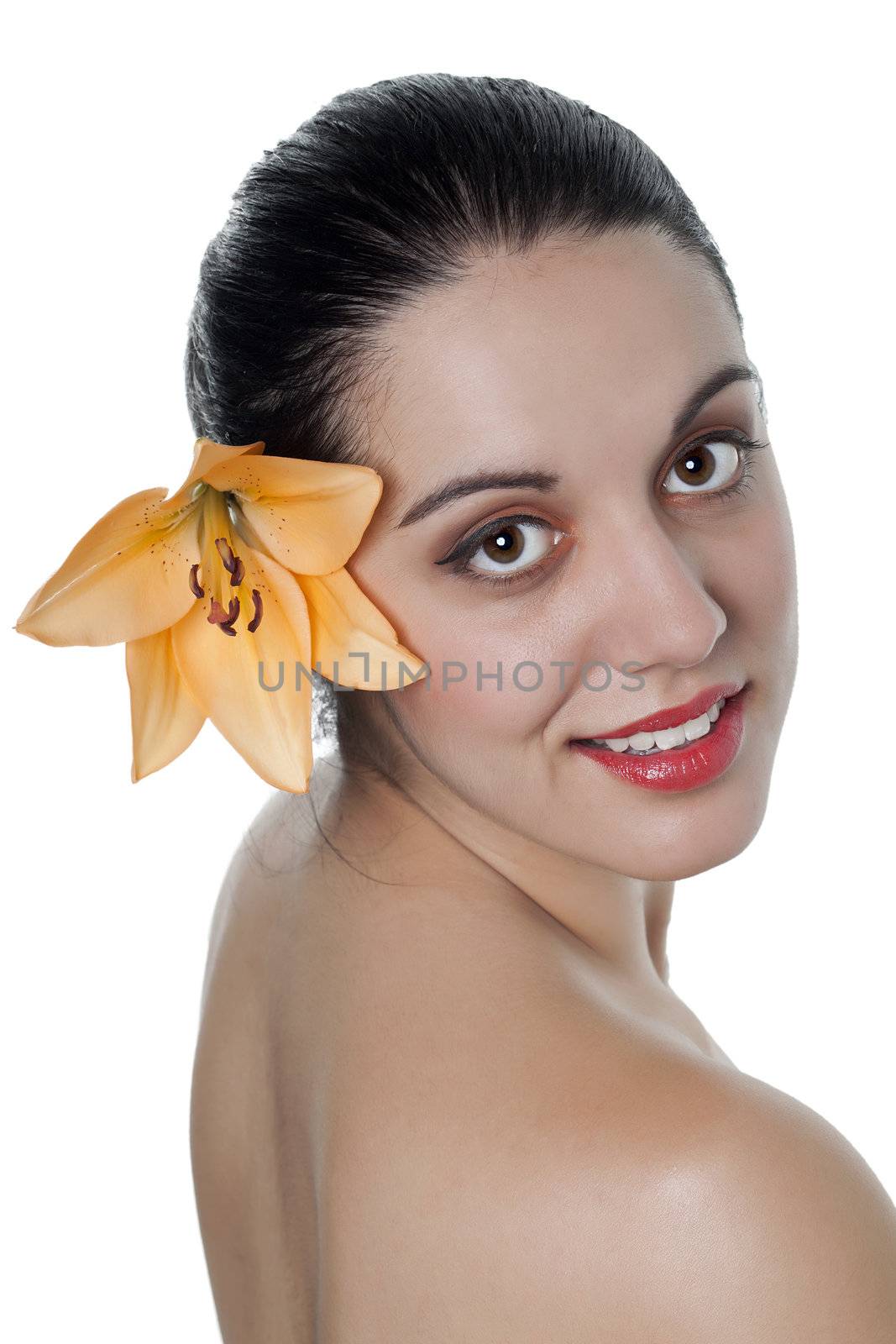 Portrait of Gorgeous woman on spa with flower on her ear