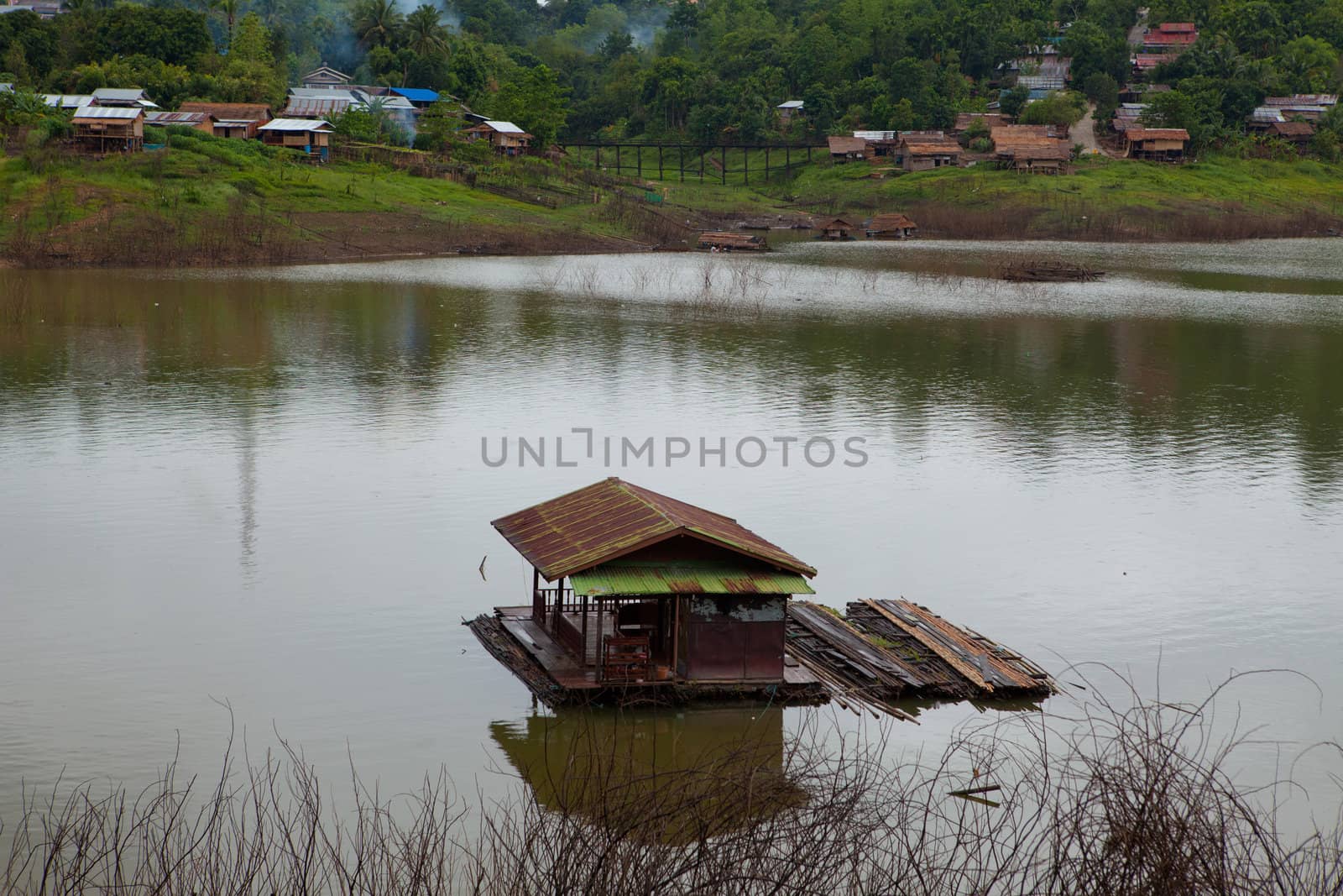 building houseboat on the lake in Thailand
