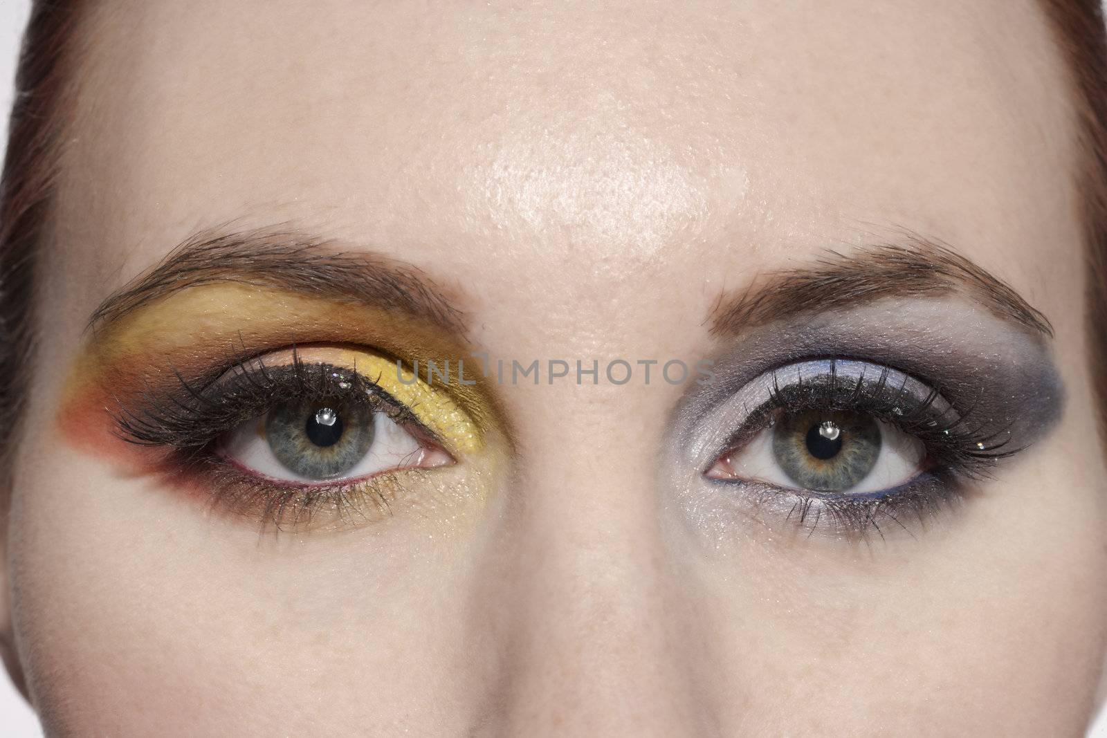 a woman with eyeshadow makeup by kozzi