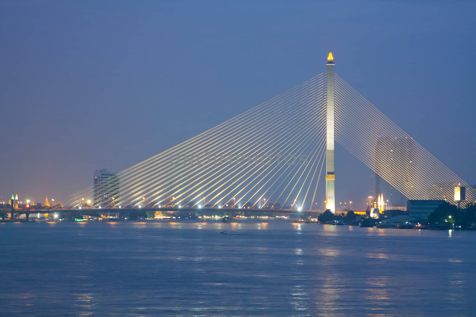 Chao Phraya river and cable bridge on sunset in Bangkok, Thailand