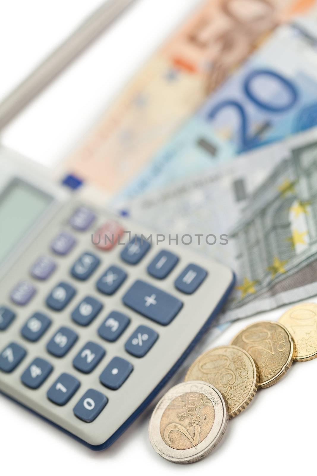 Cash and coins witch pocket calculator on a white background