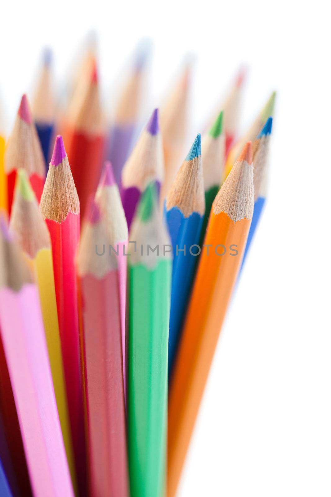 Mixing of horizontal color pencils on a white background