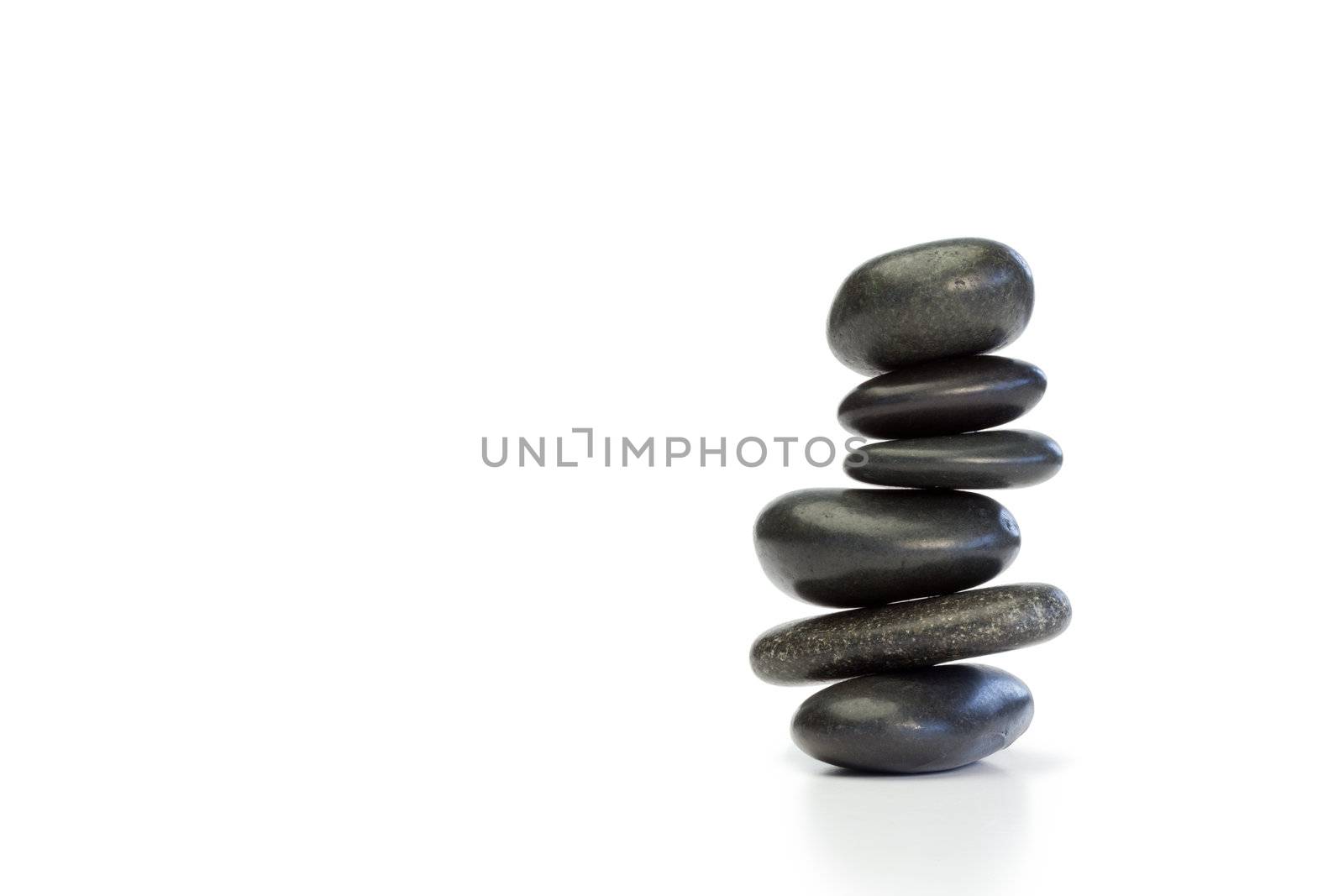 Piled up pebbles on a white background