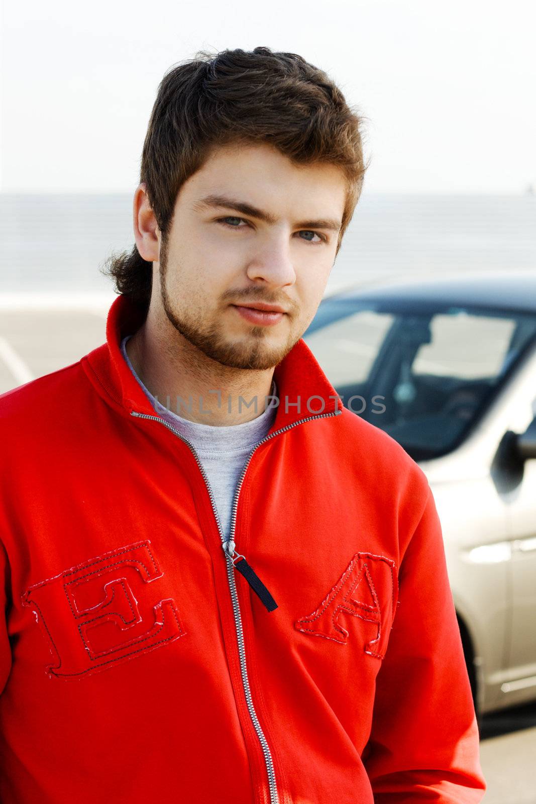 Hansdsome young man in red jacket