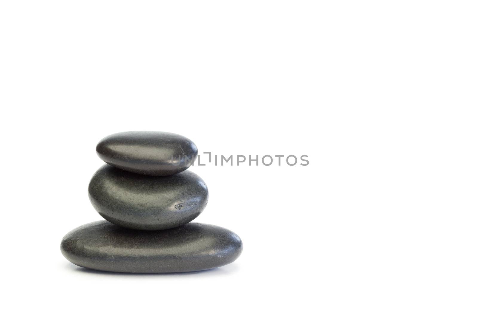 Piled up pebbles on a white background
