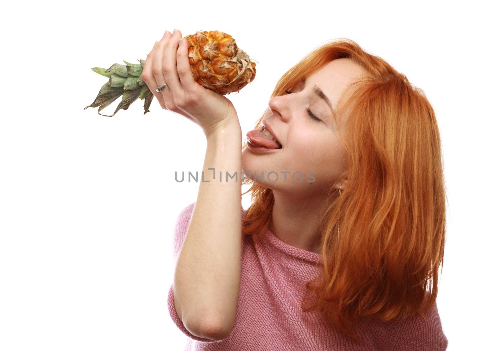 Cute girl leaking pineapple juice from her hand