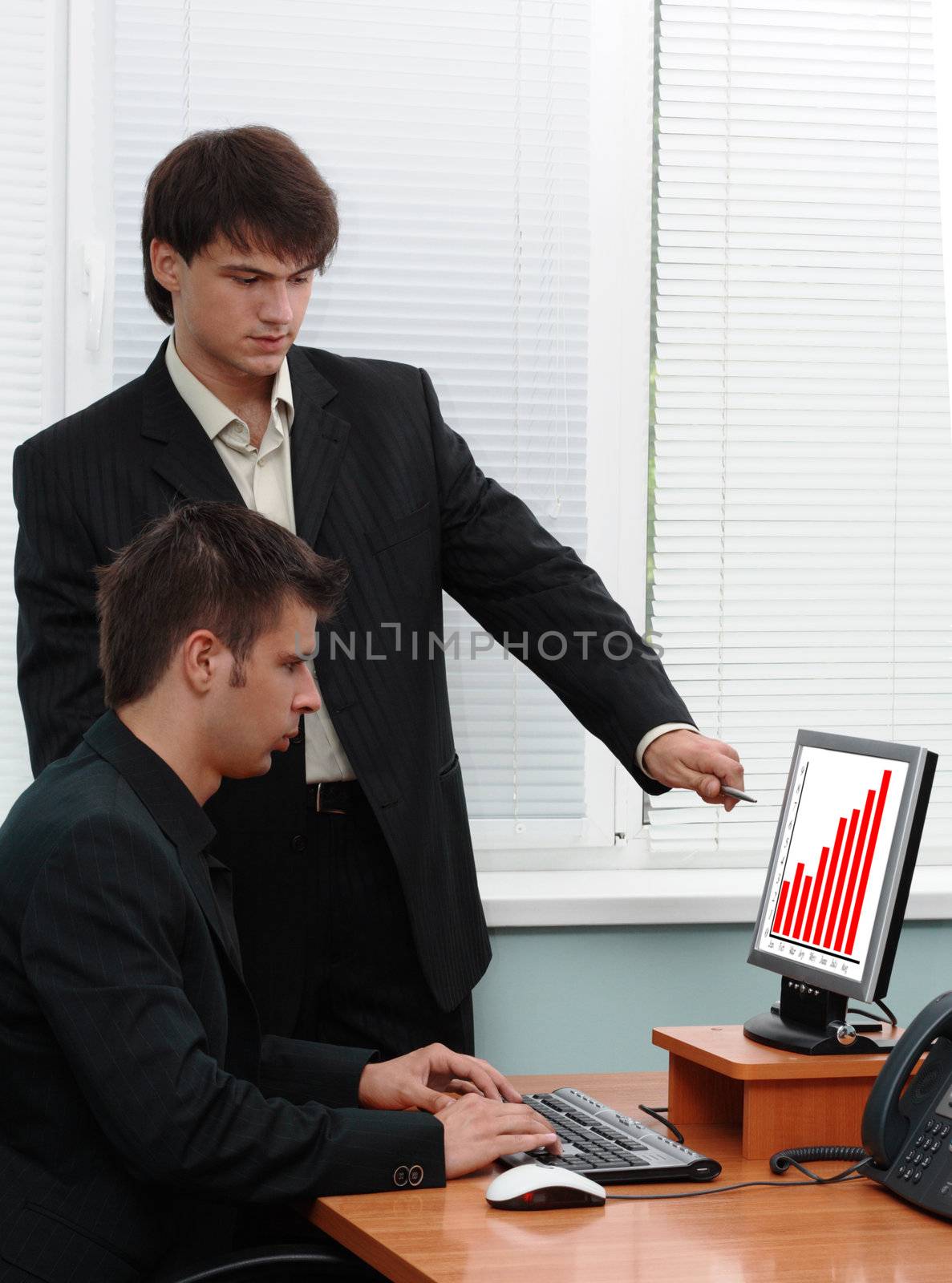 Two businessmen in an office by Gdolgikh