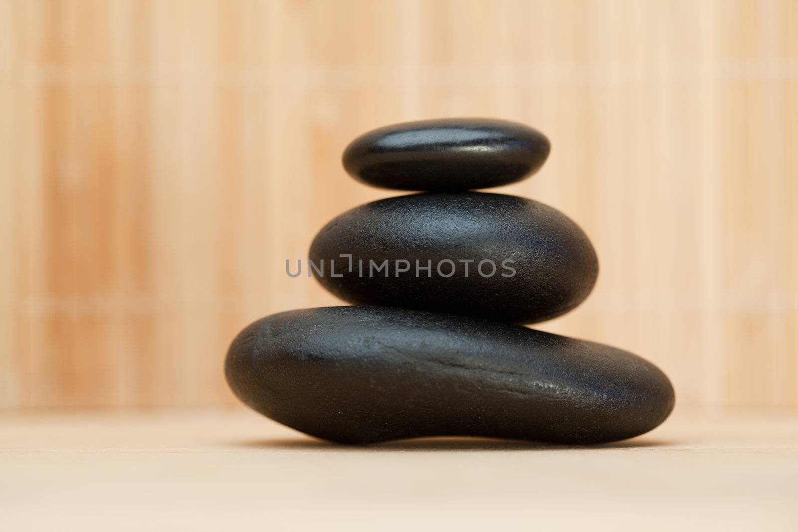 Piled up pebbles on a brown background