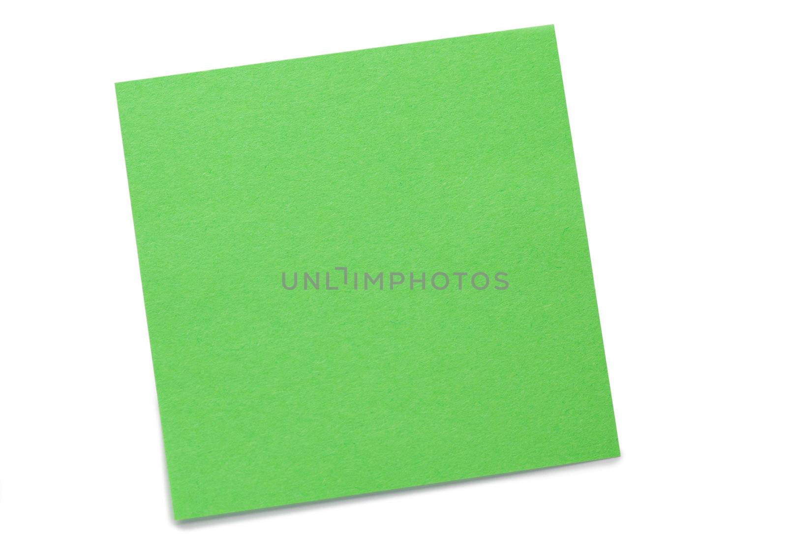 Green post-it on a white background