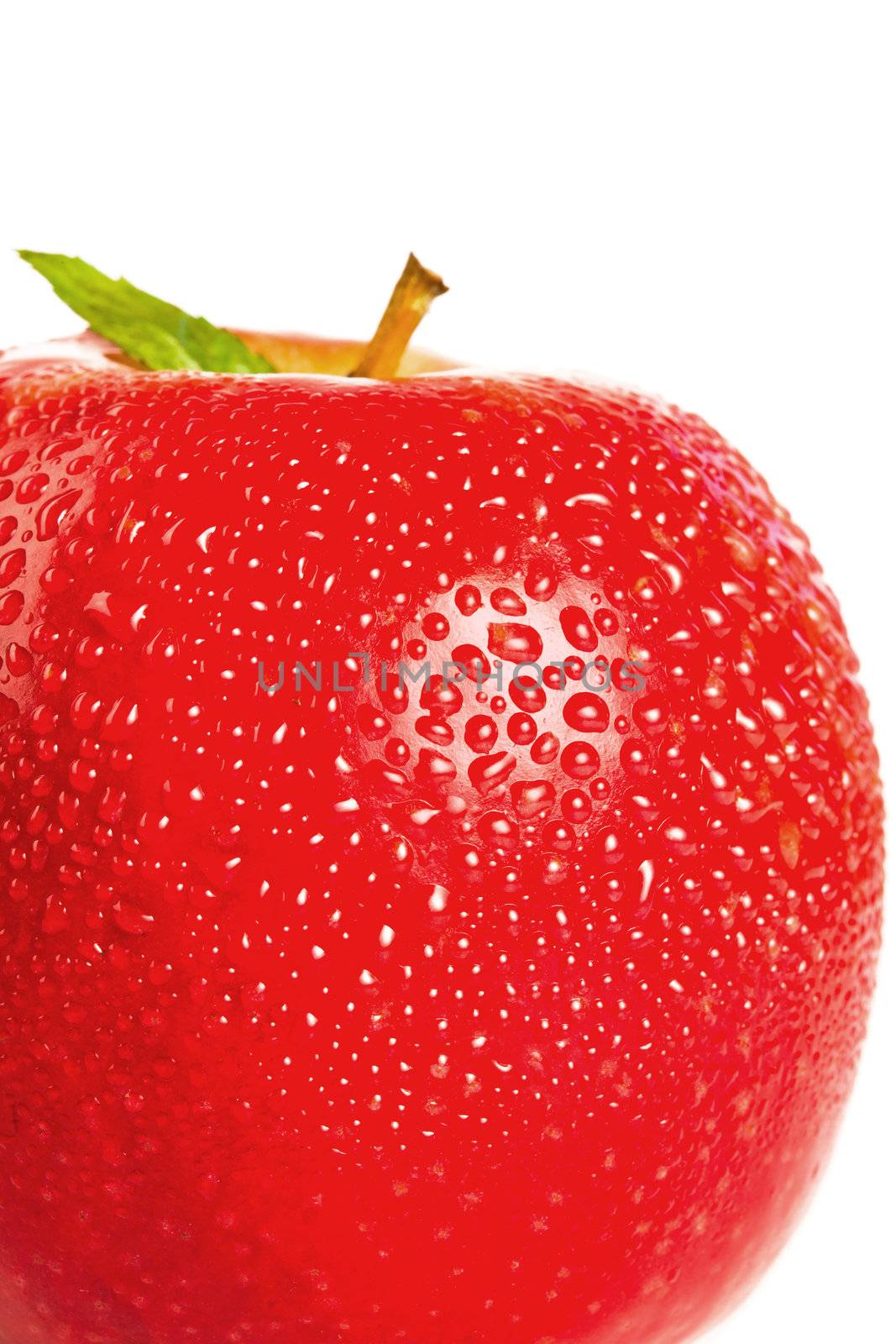 Three quarters of a red wet apple on a white background