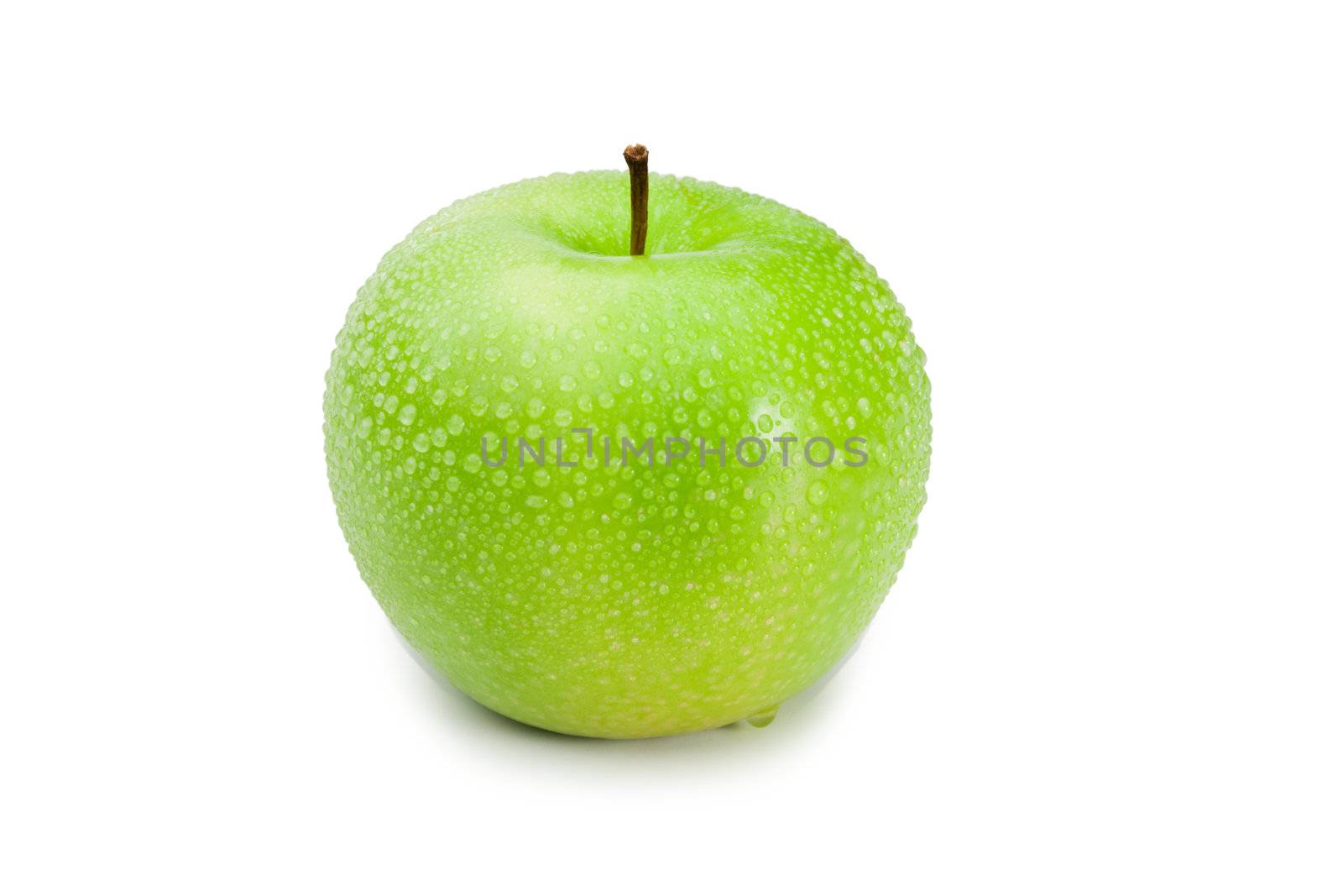 Green wet apple on a white background
