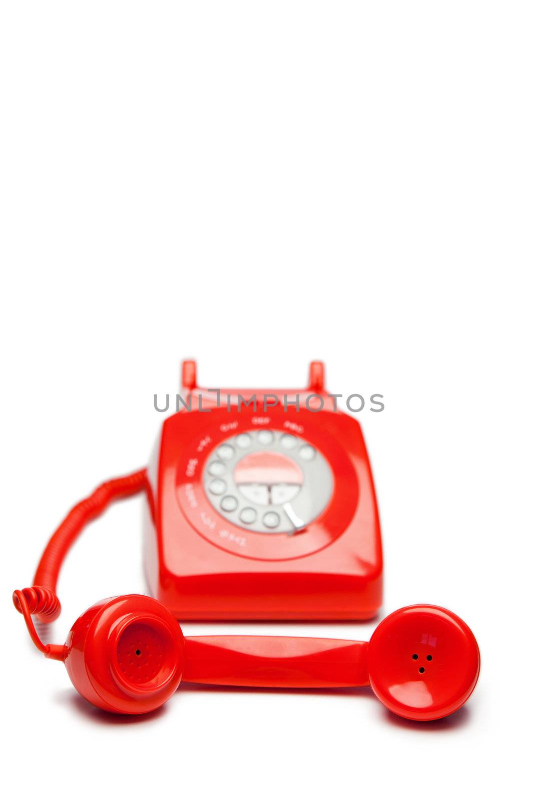 Fashion red telephone on a white background