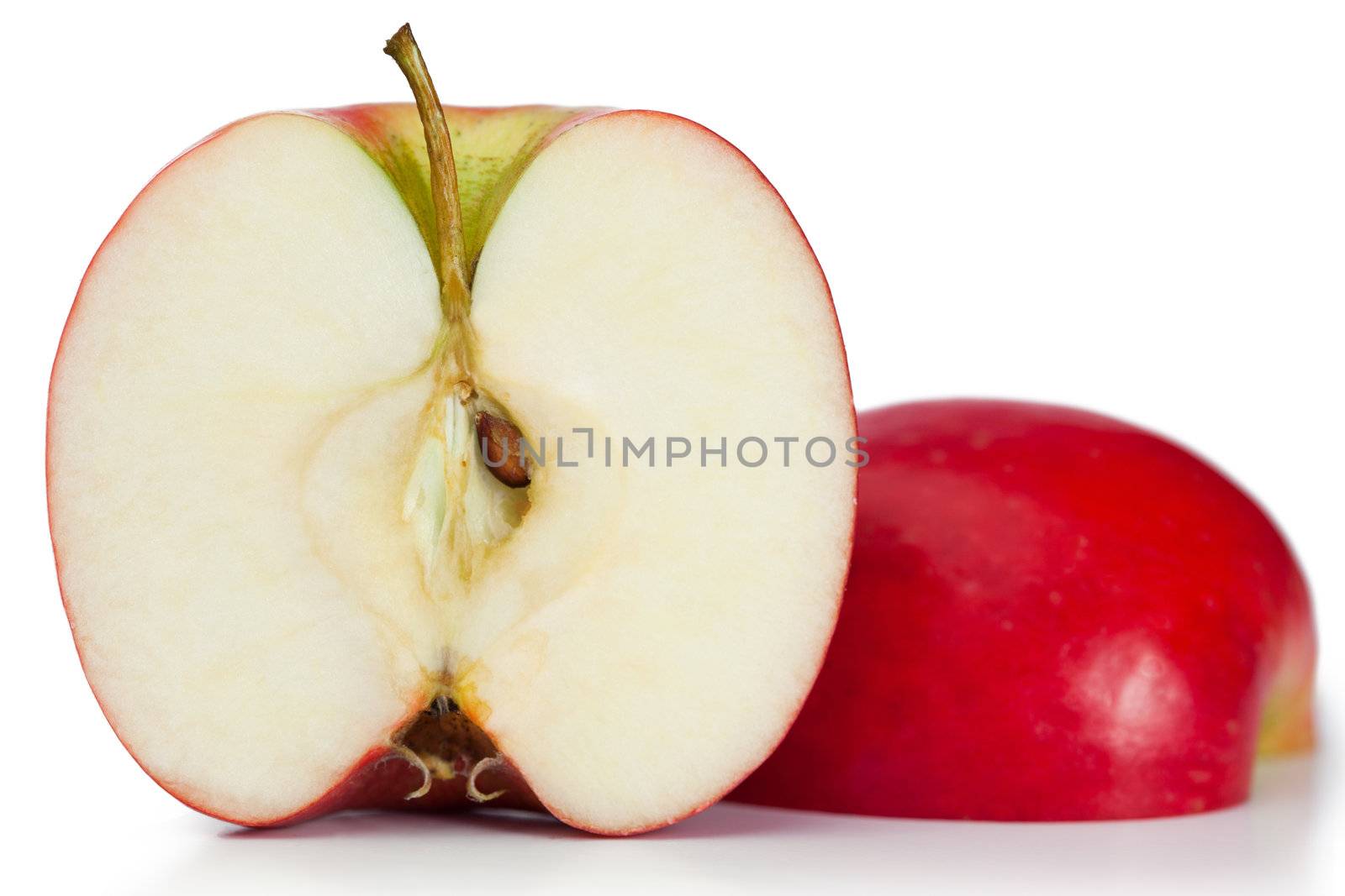 Red halved apple on a white background