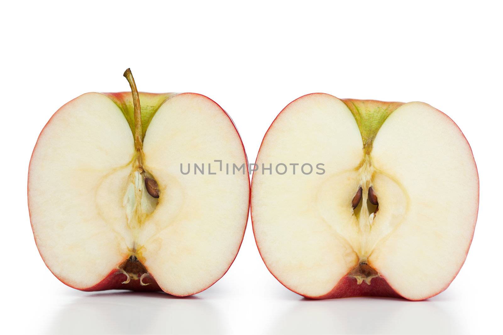Angled halved apple on a white background