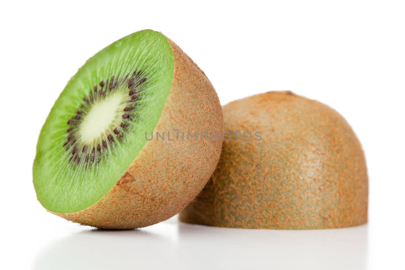 Halved kiwi on a white background