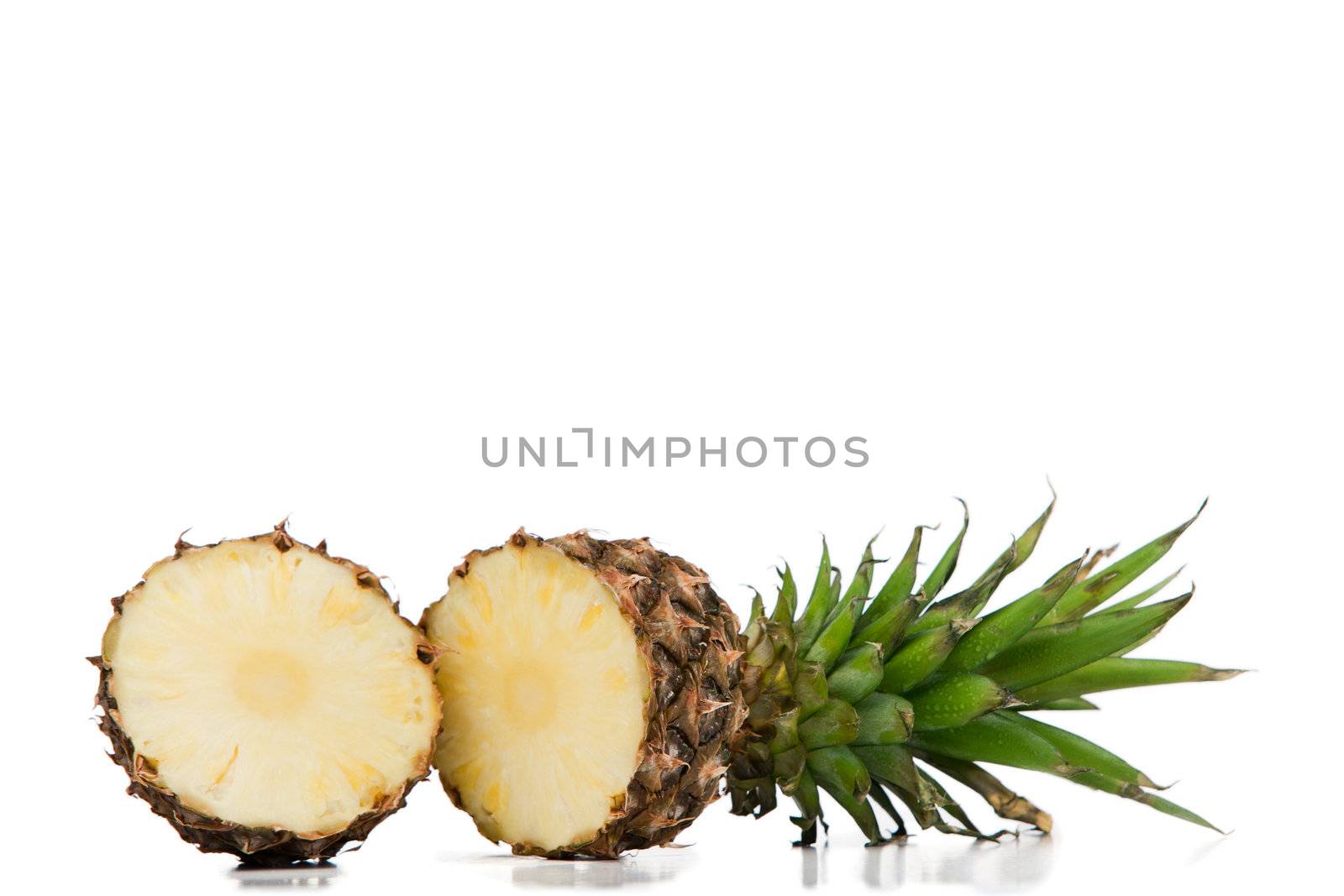 Halved pineapple on a white background