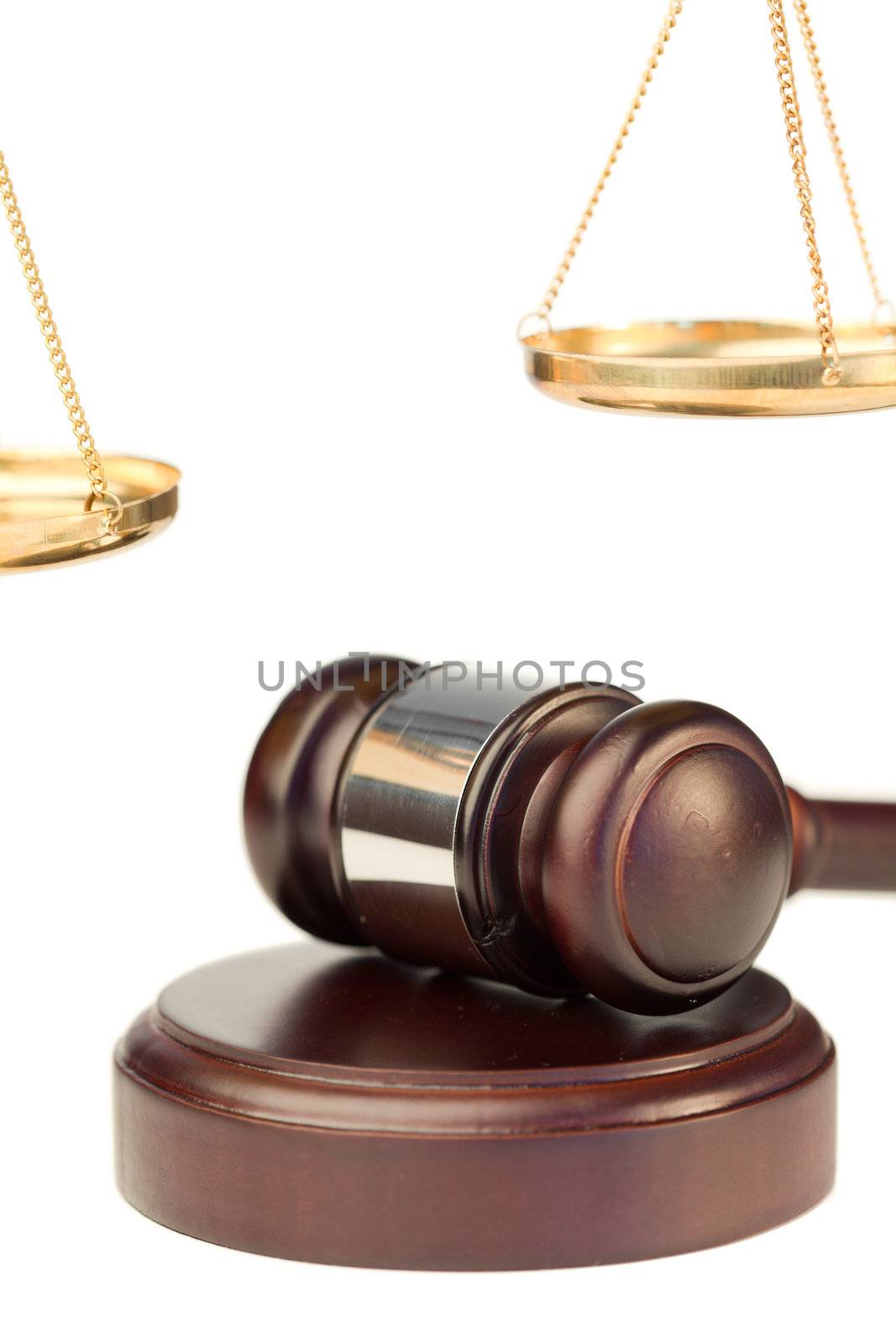 Gavel and golden scale of justice on a white background