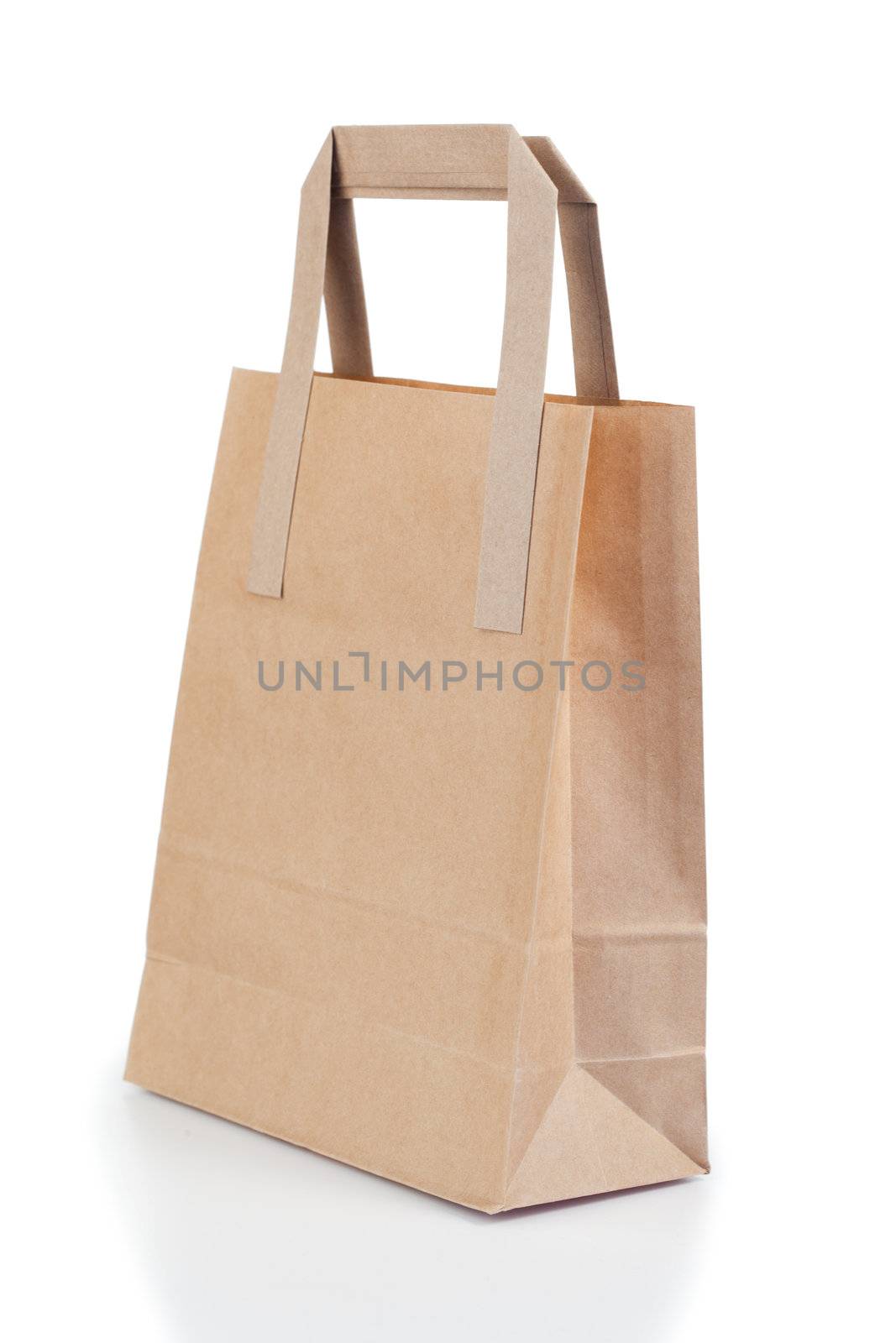 Angled brown paper bag on a white background