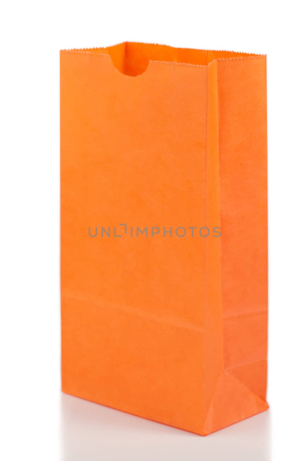 Angled orange paper bag on a white background