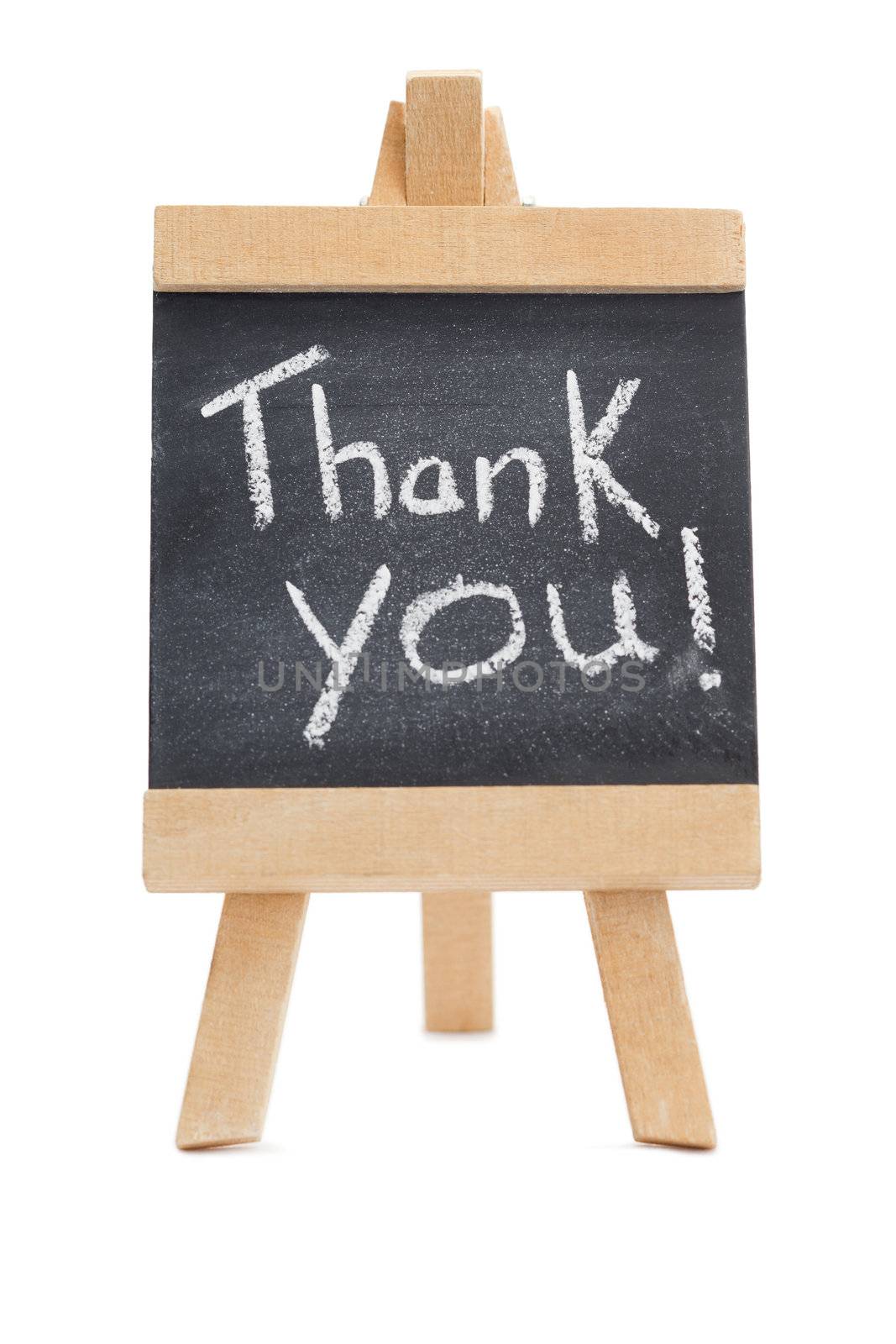 Chalkboard with the words thank you written on it isolated against a white background