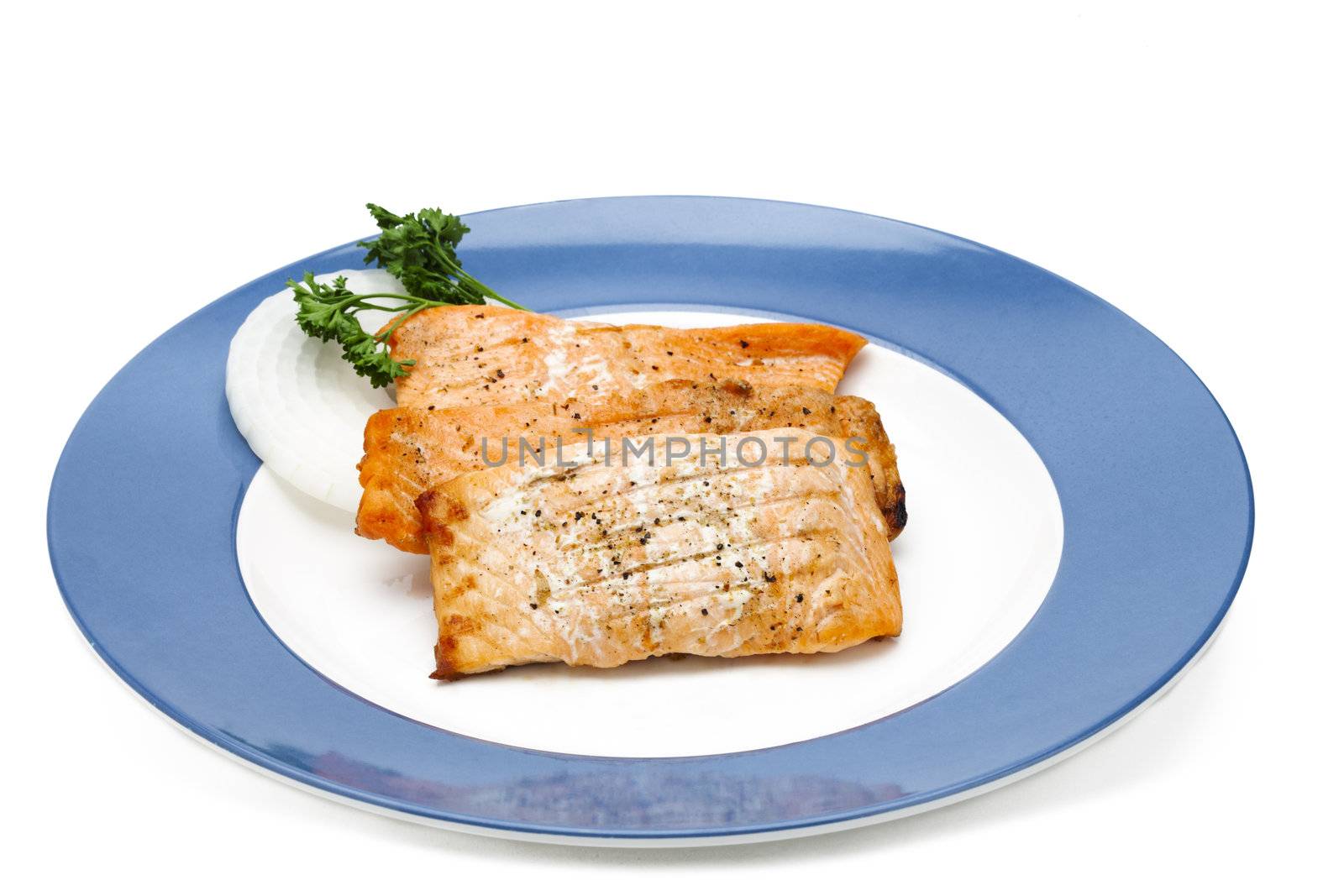Cooked salmon on a dinner plate. 