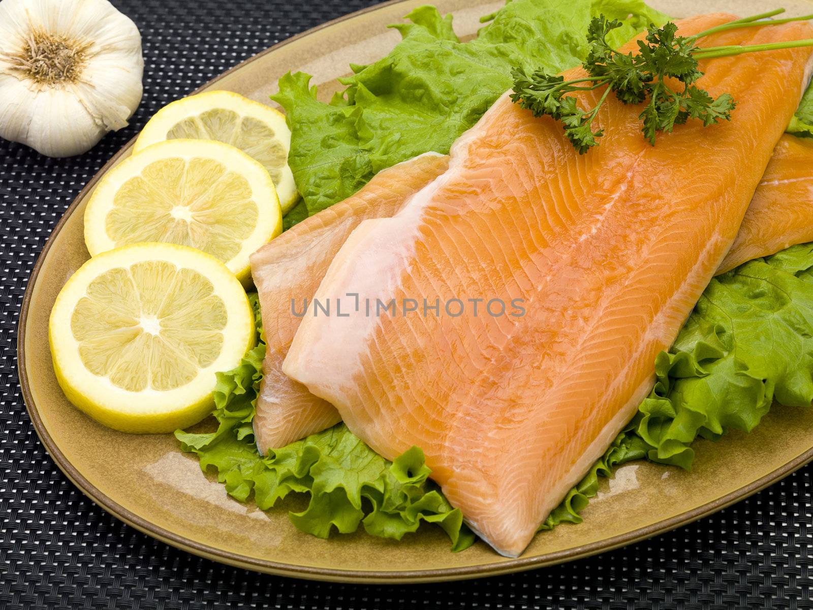 Raw salmon served in plate.