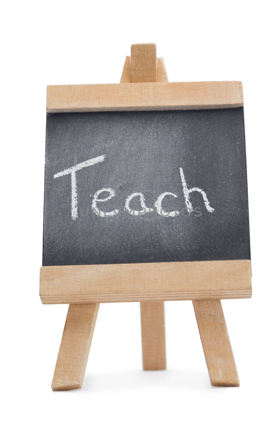 Chalkboard with the word teach written on it isolated against a white background