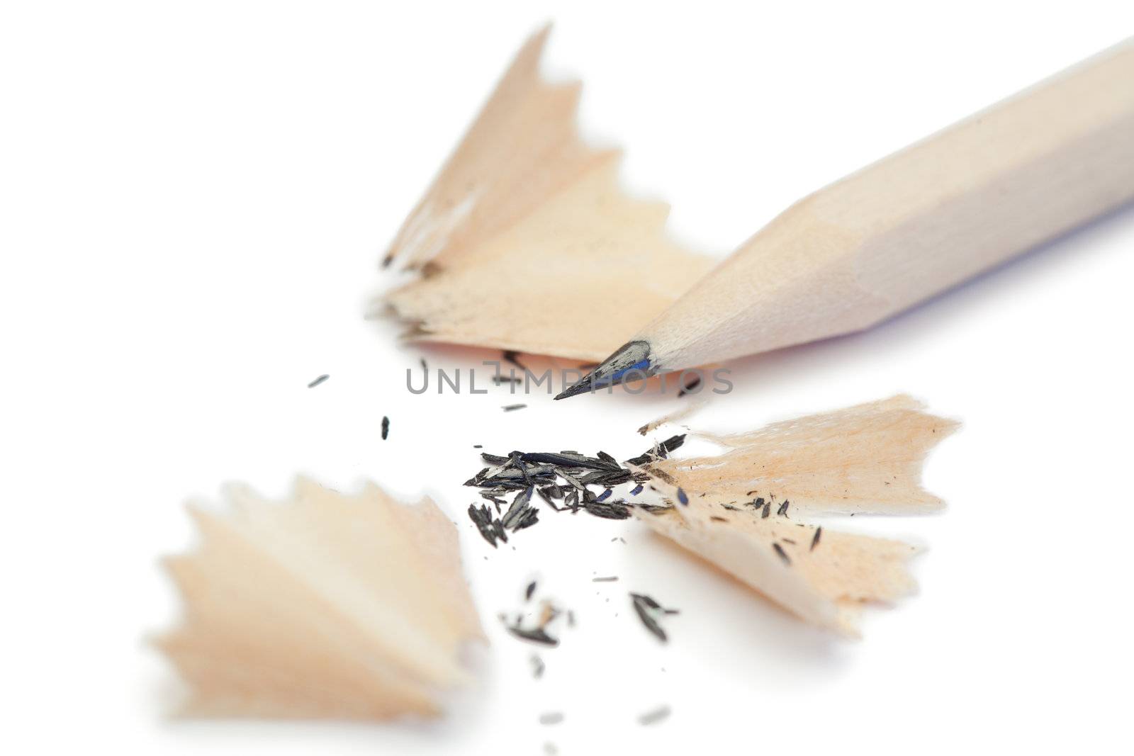 White pencil and its peelings on a white background