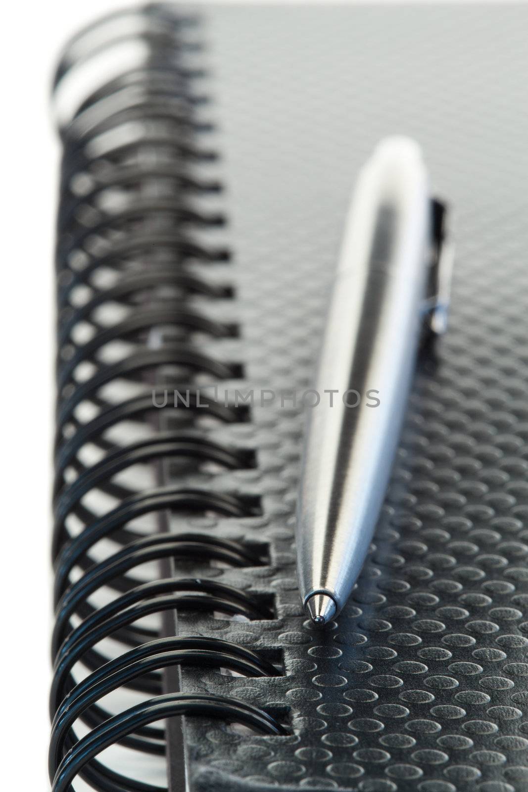Black agenda and pen on a white background