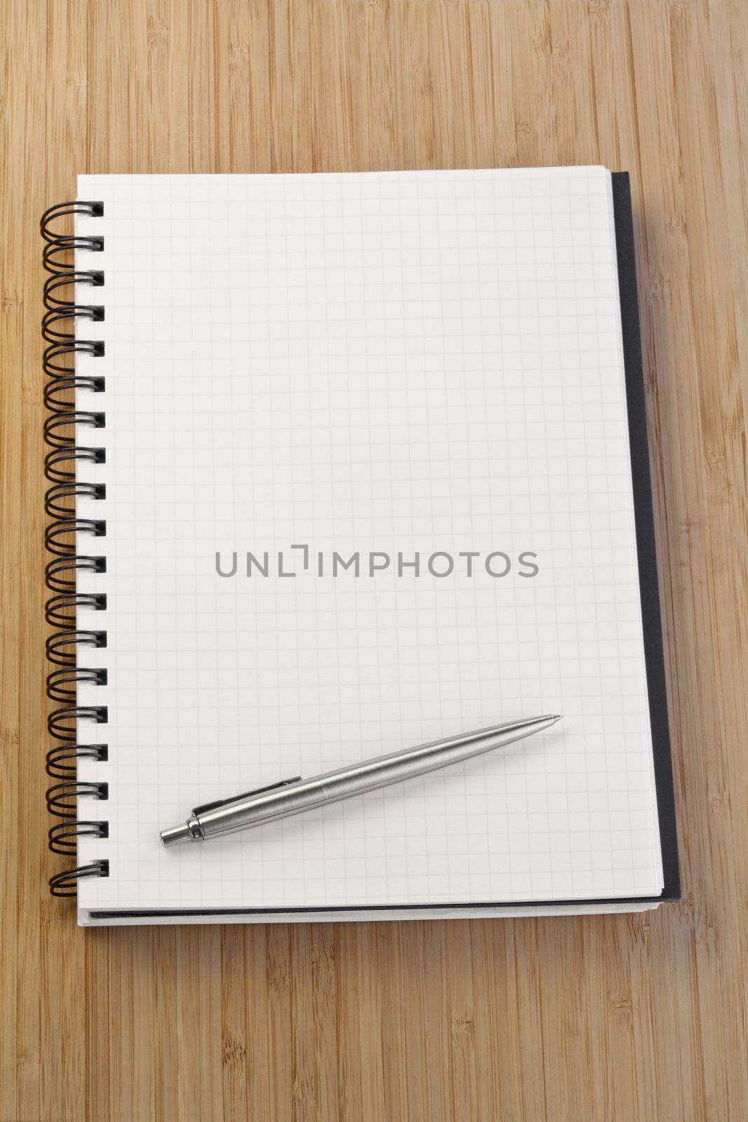 Notebook and pen on a desk