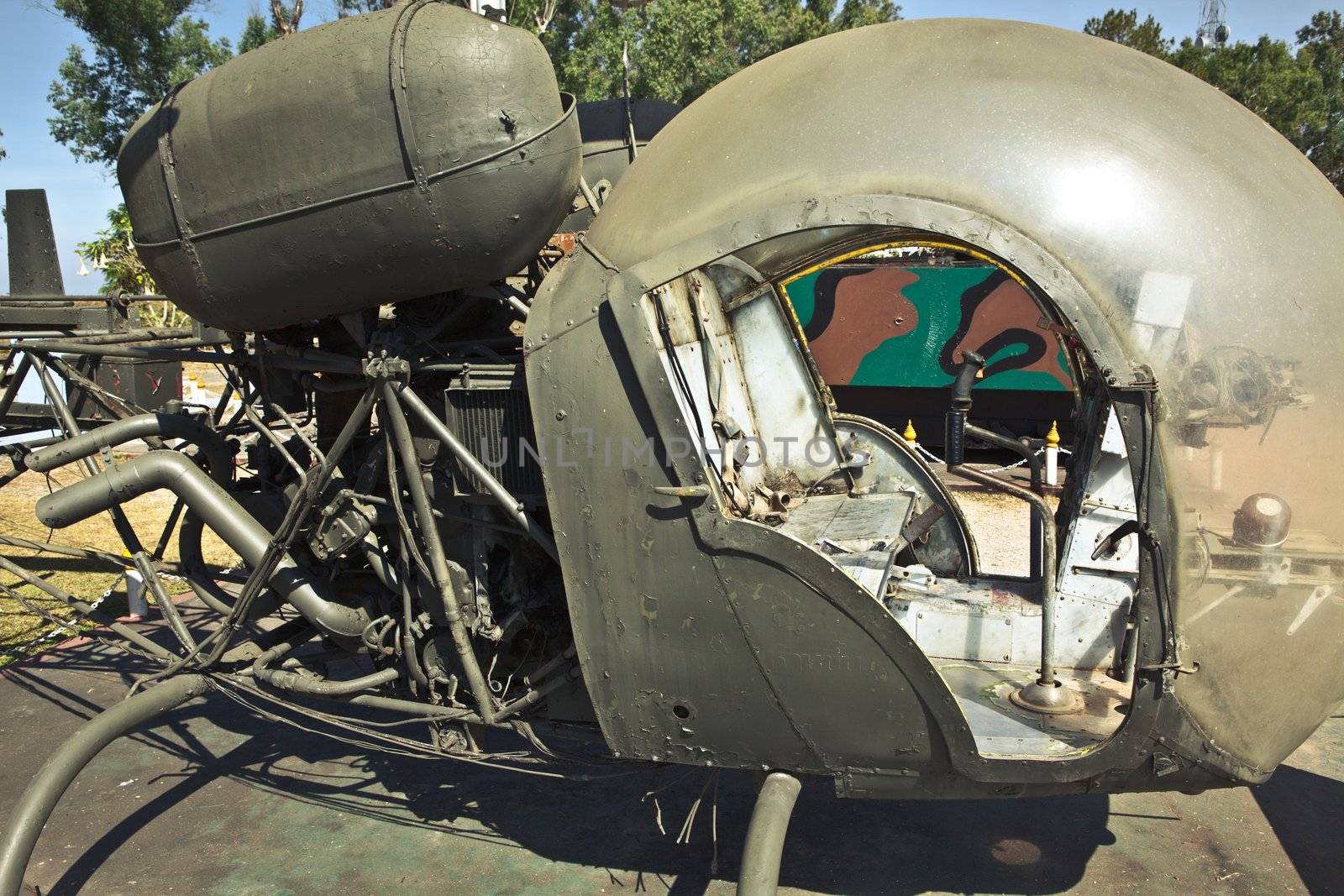 Detail of a old green military helicopter