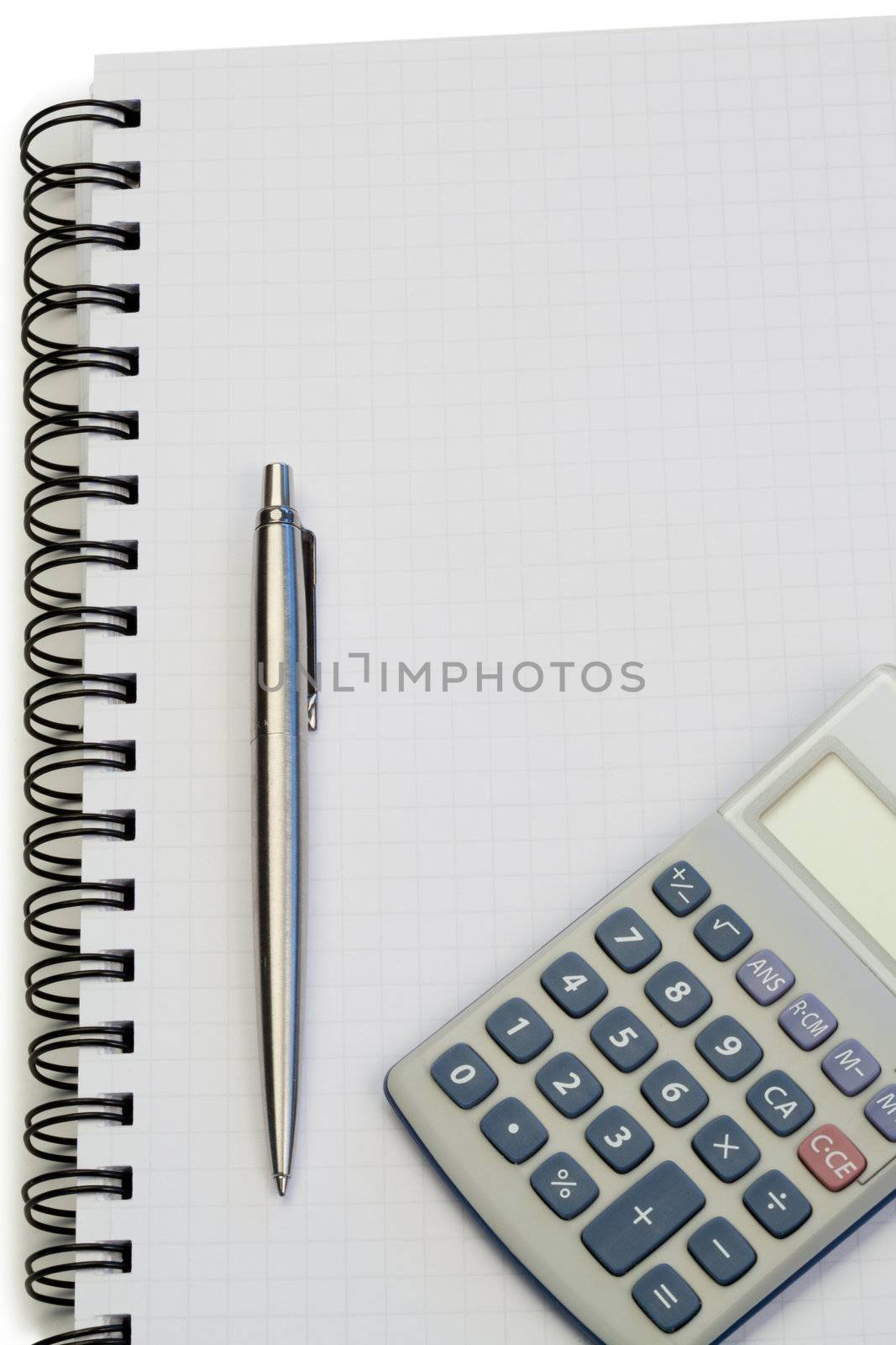 Notebook with pencil and pocket calculator on a white background