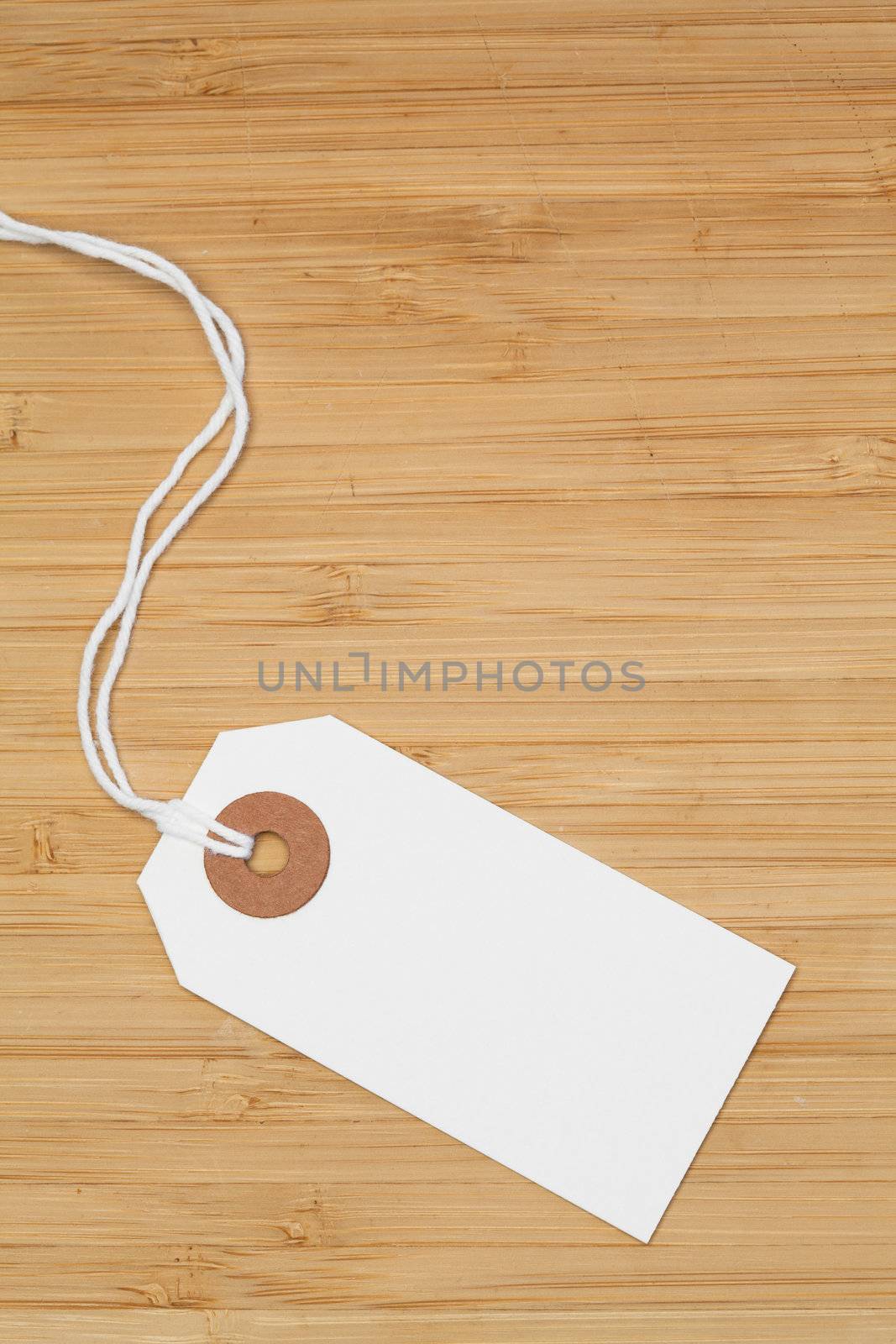 White tag isolated on a desk