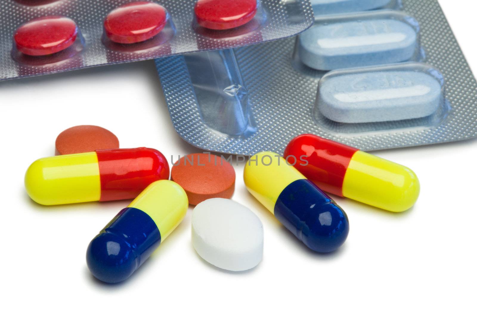 Capsules and blister strips on a white background