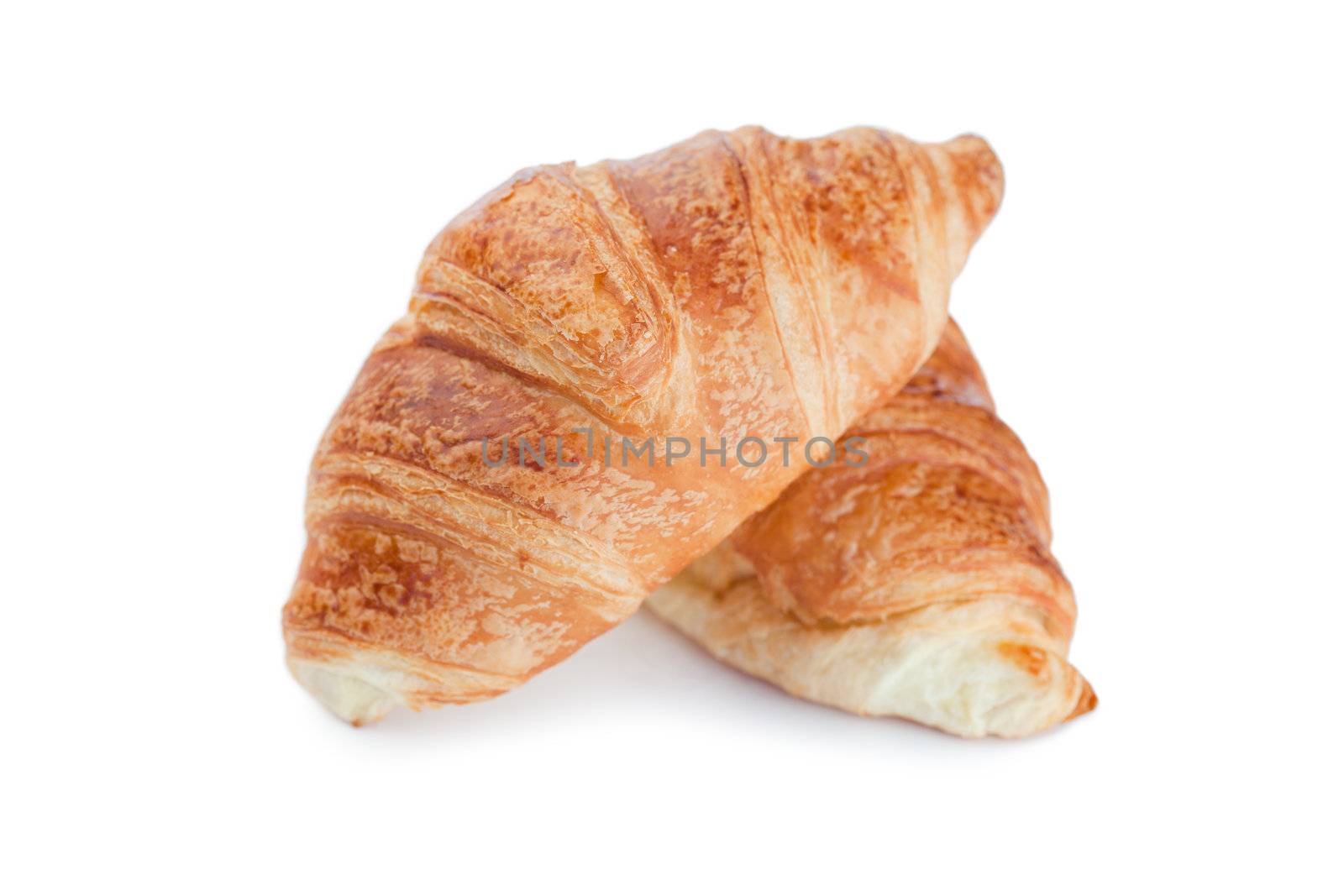 Golden croissants on a white background 