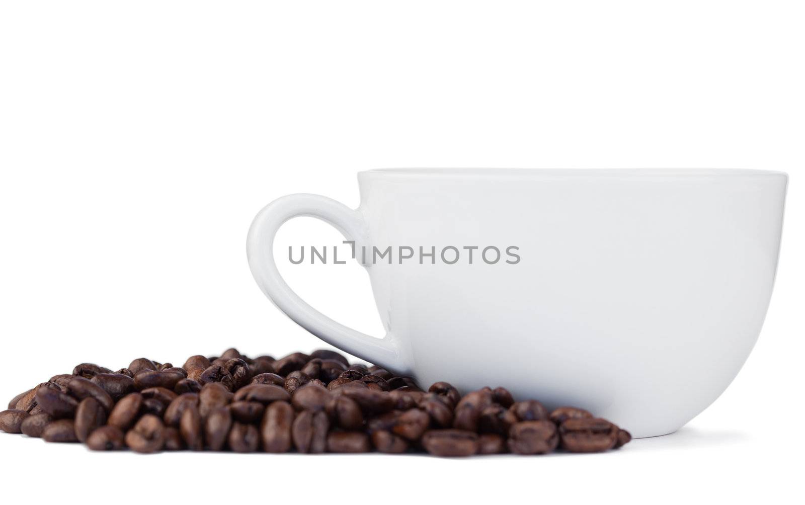 Coffee beans and cup of coffee on a white background