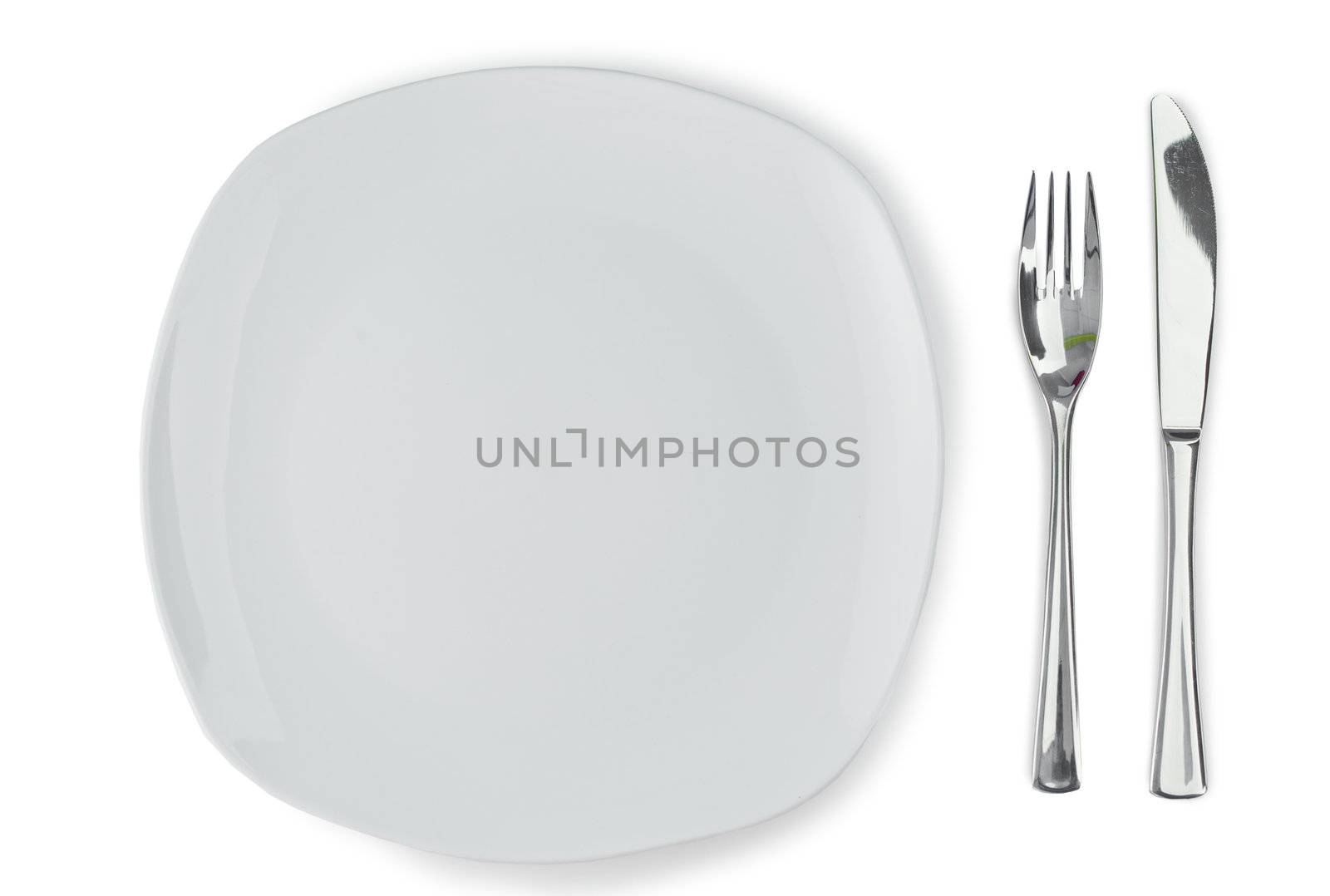 Plate and cultery on a white background