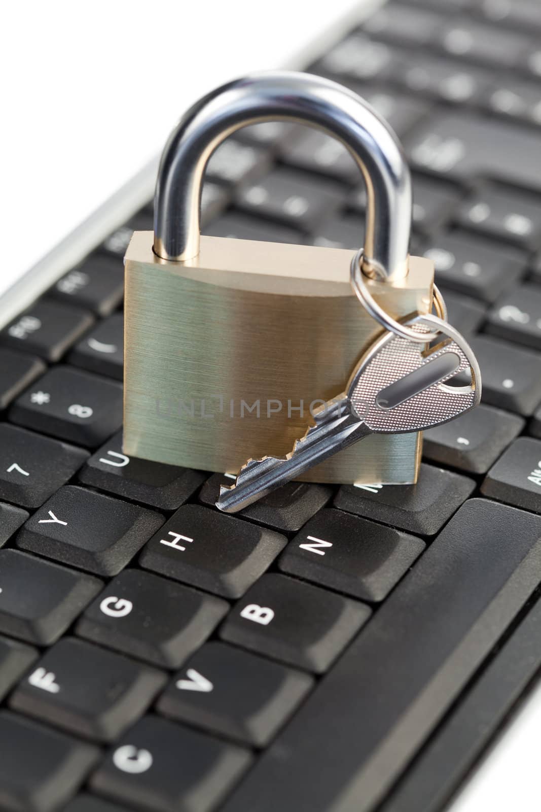 Padlock standing on a keyboard on a white background